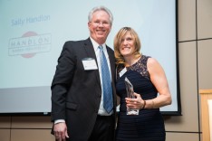 Outgoing LVEDC Board of Directors Chairman Tom Garrity (left) presented the MVP of the Year Award to Sally Handlon (right).