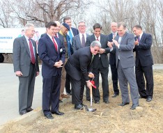 Dan Marcante, HCSC vice president and COO, scoops the first shovelful of dirt at the groundbreaking ceremony.