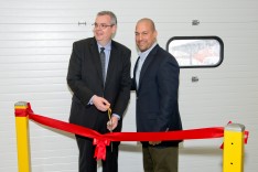Todd Schurra of the Curtiss-Wright Corporation (left) and Jim Petrucci of J.G. Petrucci Co. cutting the ribbon at the grand opening of the $25 million new facility.