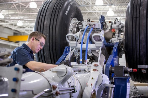 A Safran employee repairing the landing gear of a Boeing 787 at the company's Toronto facility. (Photo courtesy Christian Fleury / CAPA Pictures / Safran)