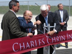 Charles Chrin and former Gov. Tom Corbett cut the ribbon at the ceremony for the new Route 33 interchange, as LVEDC President & CEO Don Cunningham (right) looks on.