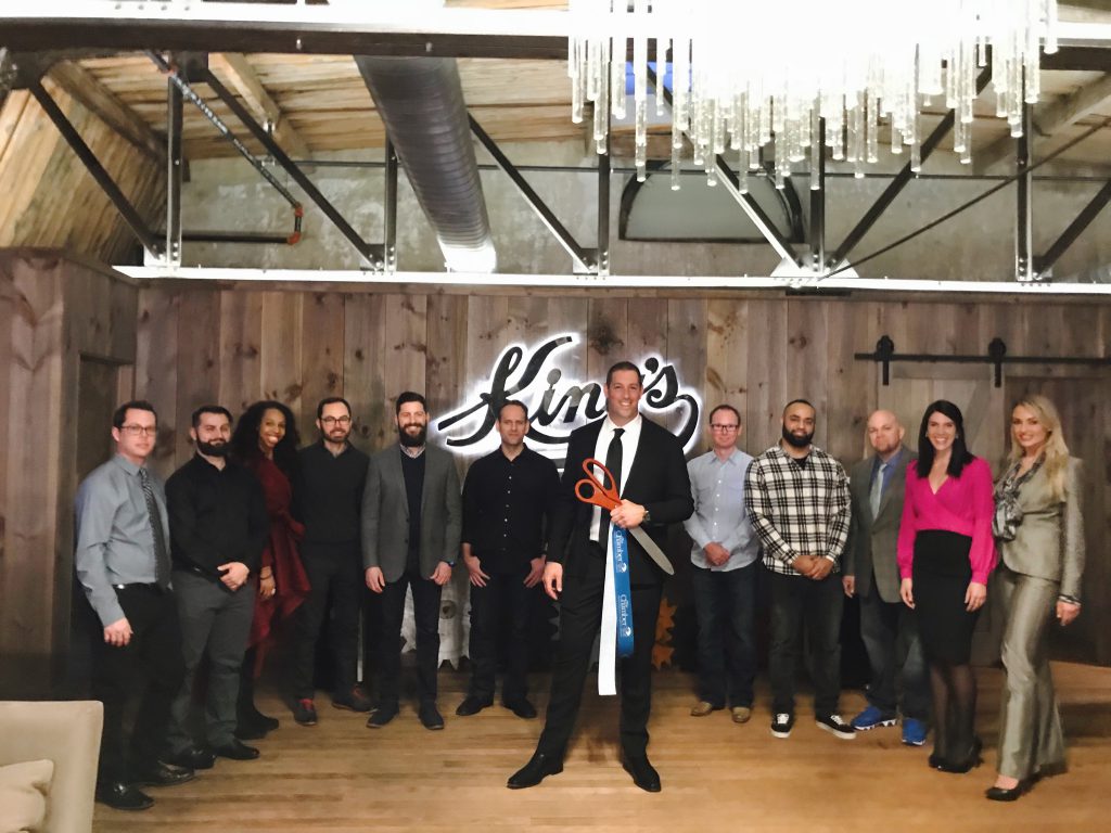 Hagai Feiner (center), Founder & CEO of Access Networks, at the ribbon-cutting for the tech company's new Easton facility.