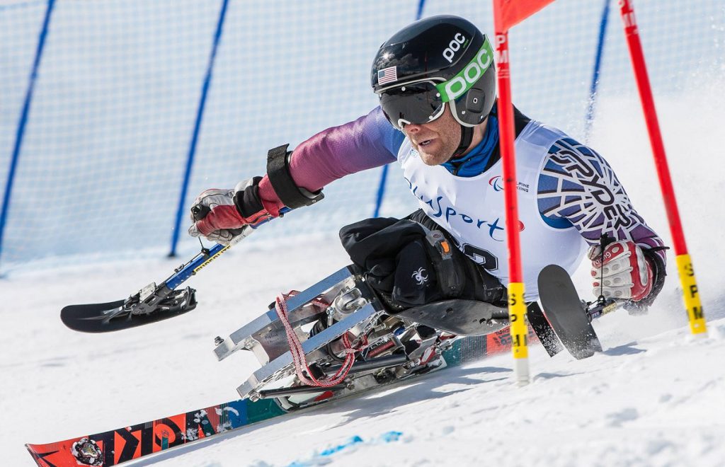 Tyler Walker, a member of the U.S. alpine ski team in the upcoming 2018 Paralympics, using a monoski made by Bethlehem-based DynAccess. (photo by Marcus Hartman)
