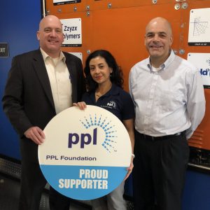 AEDC Executive Director Scott Unger (left) and Program Manager Anthony Durante (right) accept a grant from Carol Obando-Derstine, PPL Electric Utilities Regional Affairs Director.