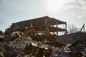 Demolition has begun on the former Guardian building at 3900 Burgess Place. (photo by J Taylor Design)